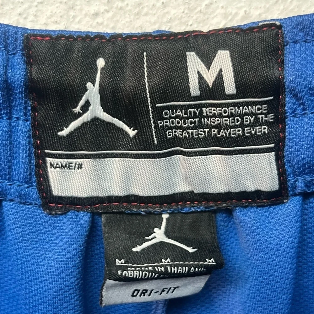 Jordan Athletic Shorts in Blue with White Stripes. Medium